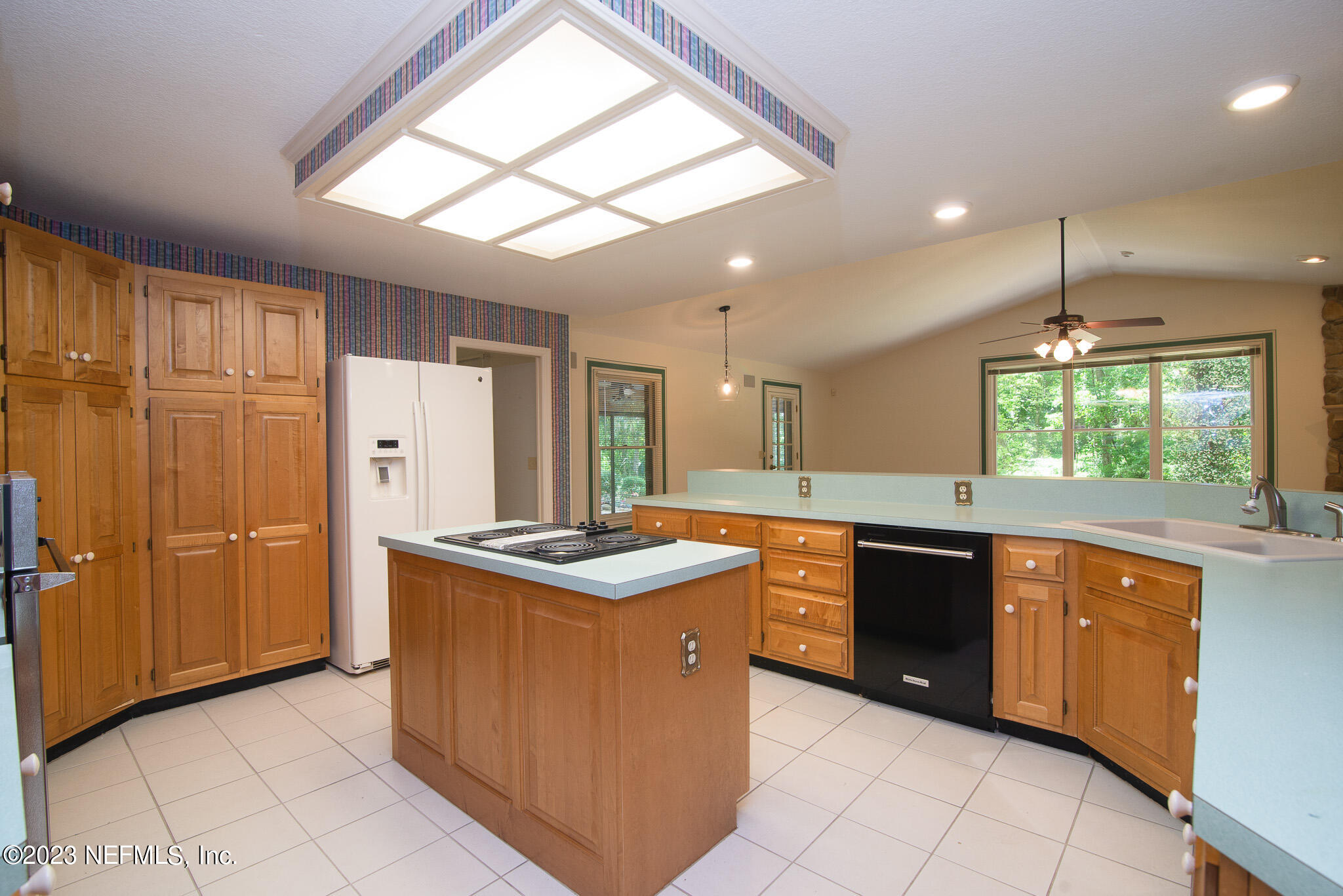4233 Wicks Branch Road St. Augustine, FL 32086 - Photo 16 of 45 a kitchen with stainless steel appliances granite countertop a stove a sink and a refrigerator