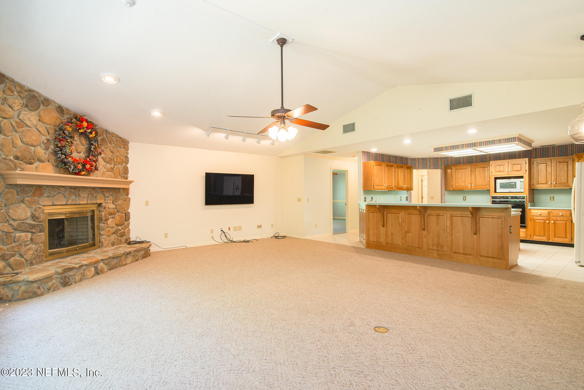 4233 Wicks Branch Road St. Augustine, FL 32086 - Photo 18 of 45 a view of a livingroom with furniture fire place and a fireplace