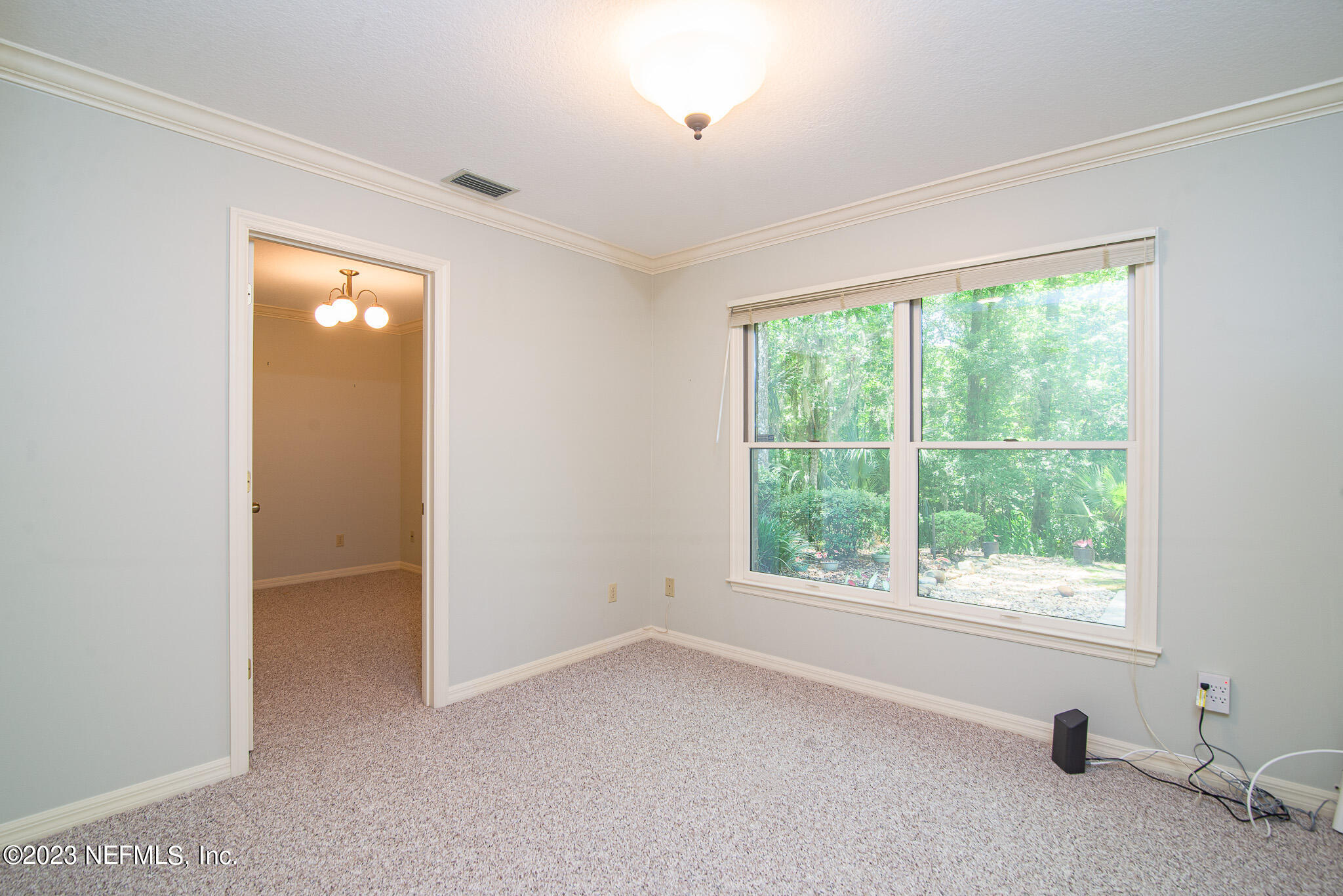 4233 Wicks Branch Road St. Augustine, FL 32086 - Photo 22 of 45 a view of an empty room with a window