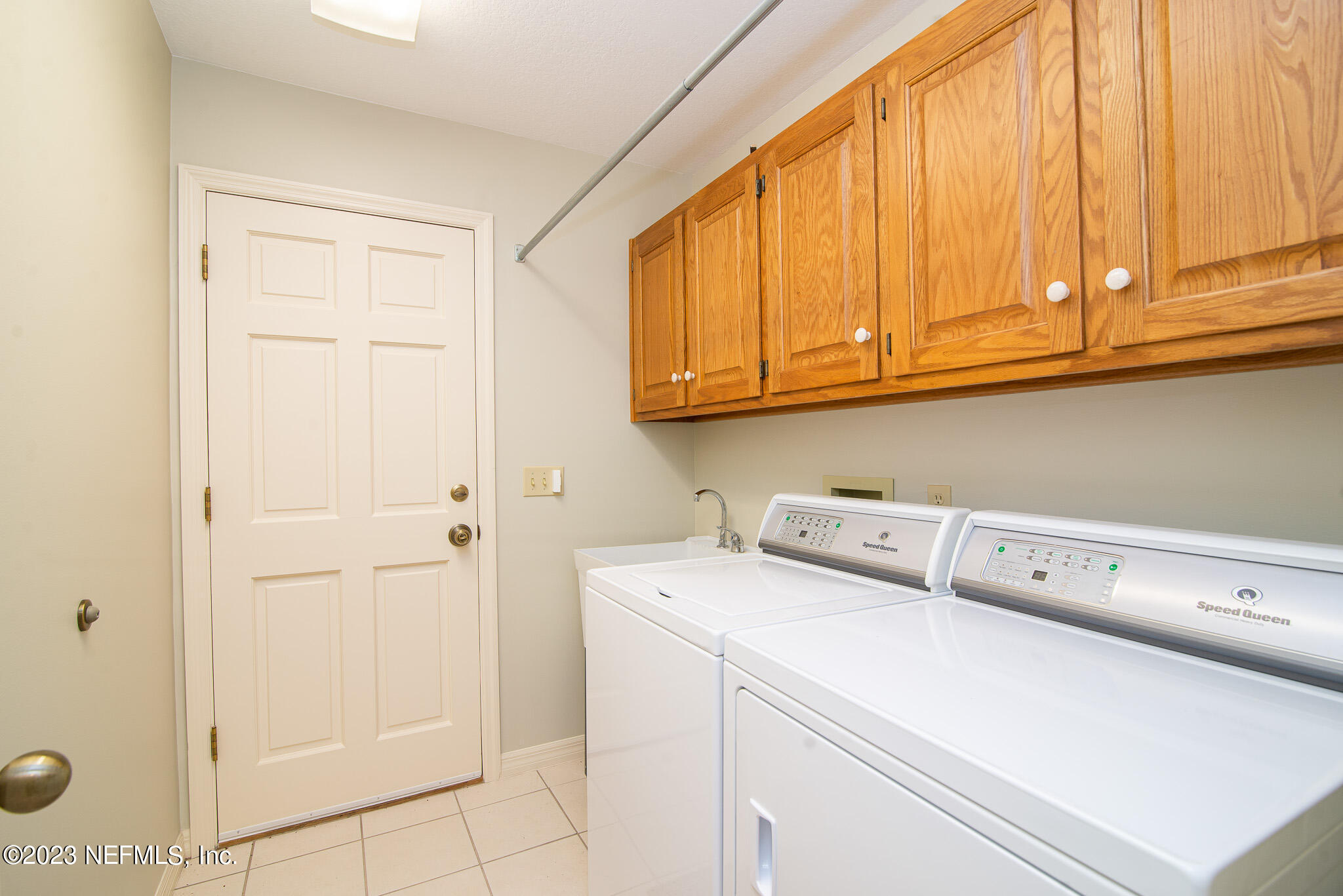 4233 Wicks Branch Road St. Augustine, FL 32086 - Photo 31 of 45 a utility room with dryer and washer