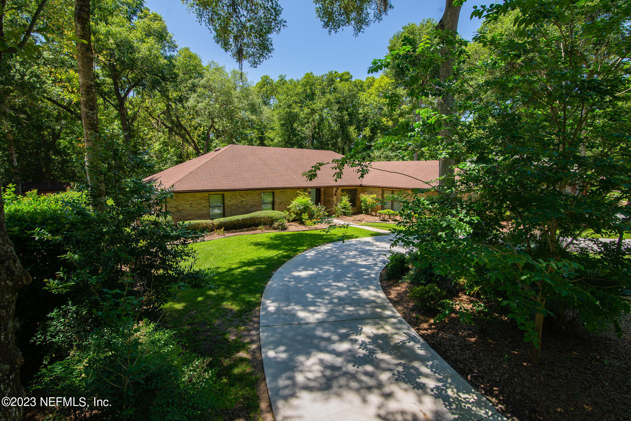 4233 Wicks Branch Road St. Augustine, FL 32086 - Photo 5 of 45 a view of a garden with an outdoor space