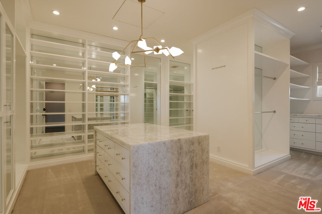 24155 Hidden Ridge Road Hidden Hills, CA 91302 - Photo 12 of 23 a view of a bathroom with a shower
