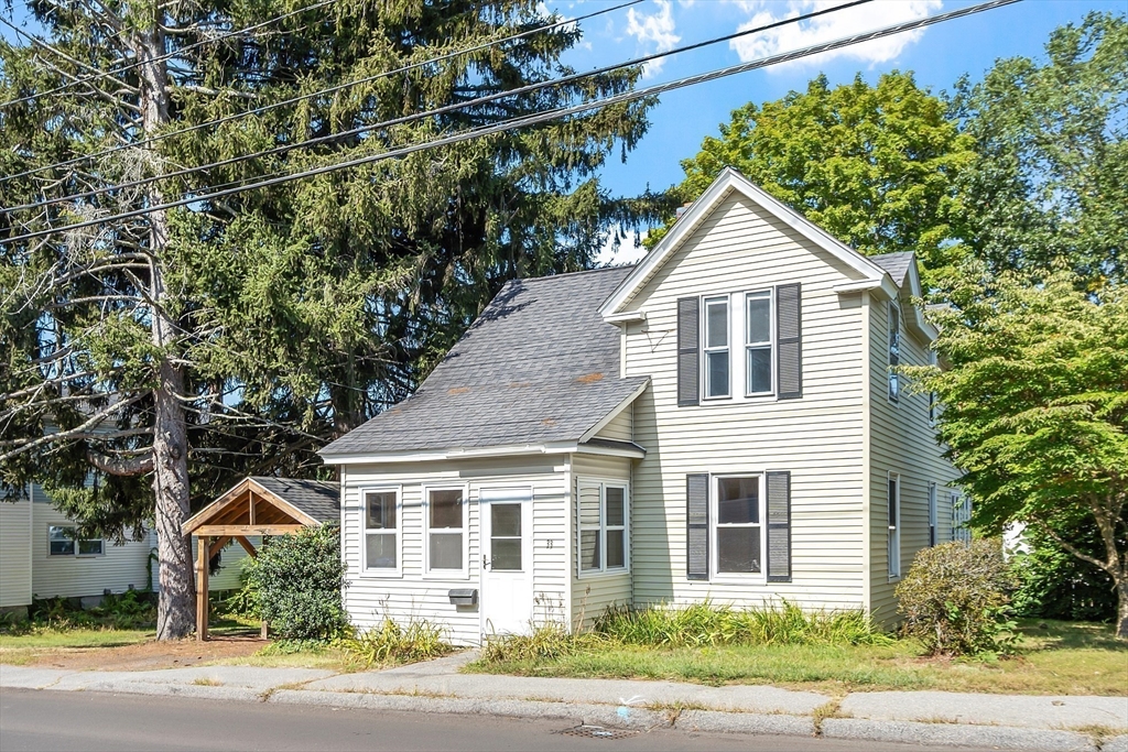 33 West Meadow Road Lowell, MA 01854 - Photo 1 of 36 a view of a house with a yard and plants