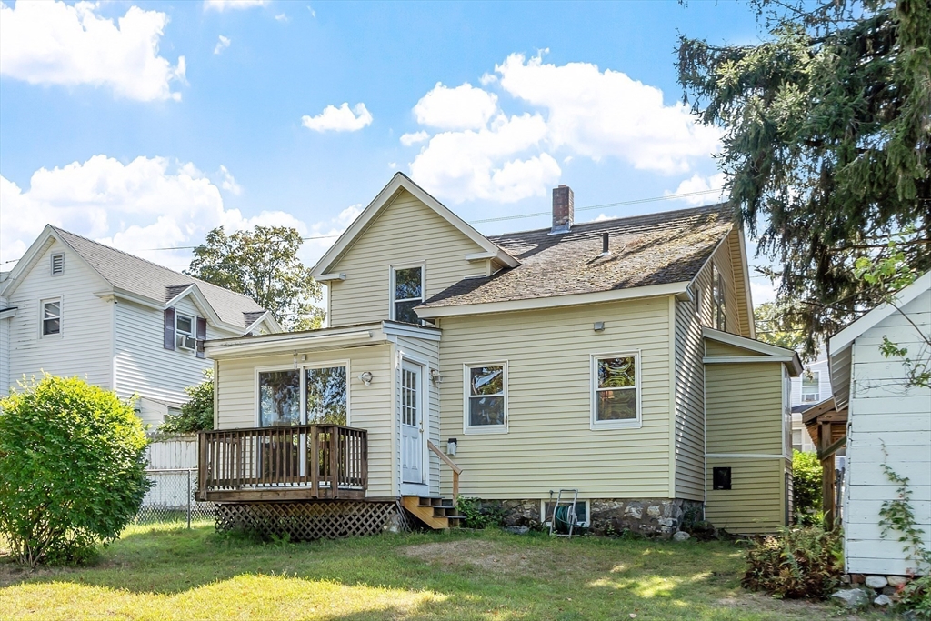 33 West Meadow Road Lowell, MA 01854 - Photo 3 of 36 a view of a house with a yard