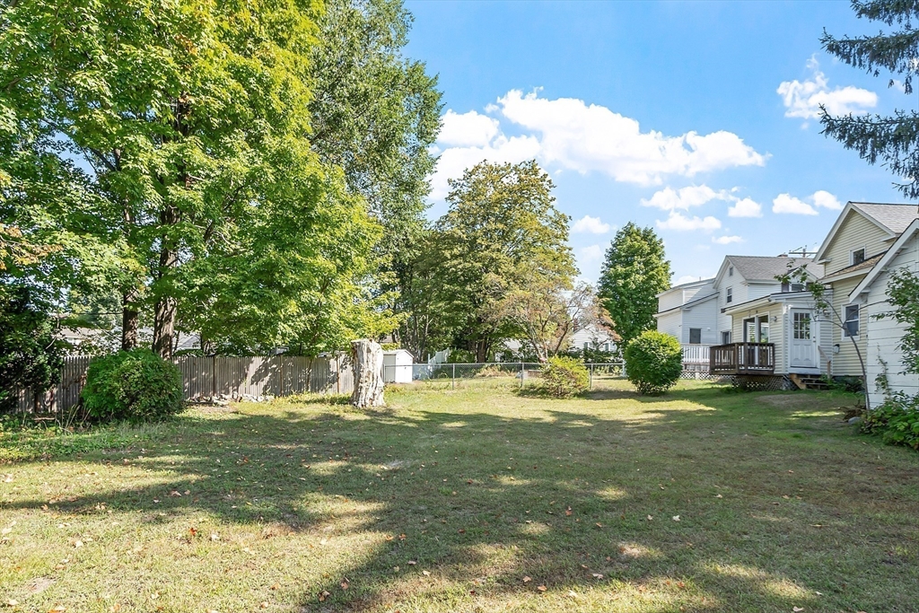 33 West Meadow Road Lowell, MA 01854 - Photo 7 of 36 a view of a yard with large trees