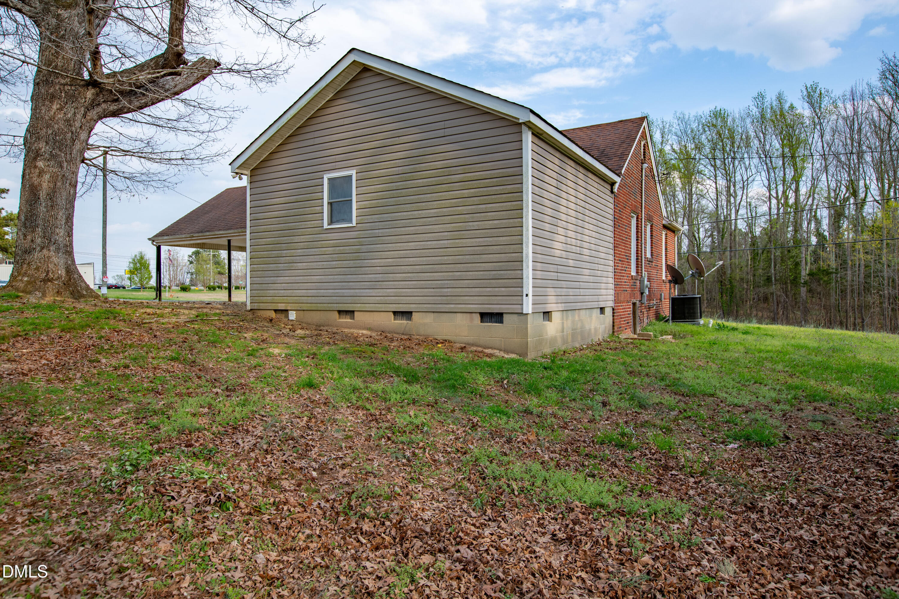 4295 Virgilina Road Roxboro, NC 27574 - Photo 39 of 46 a view of a house with yard and a garden