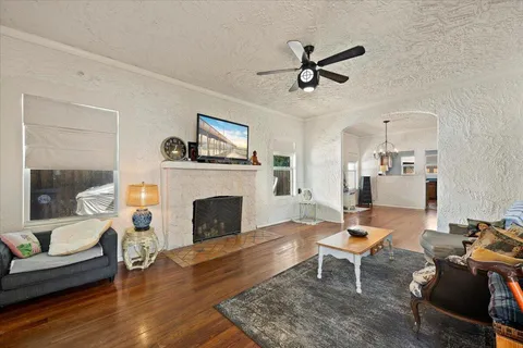 a living room with furniture and a fireplace