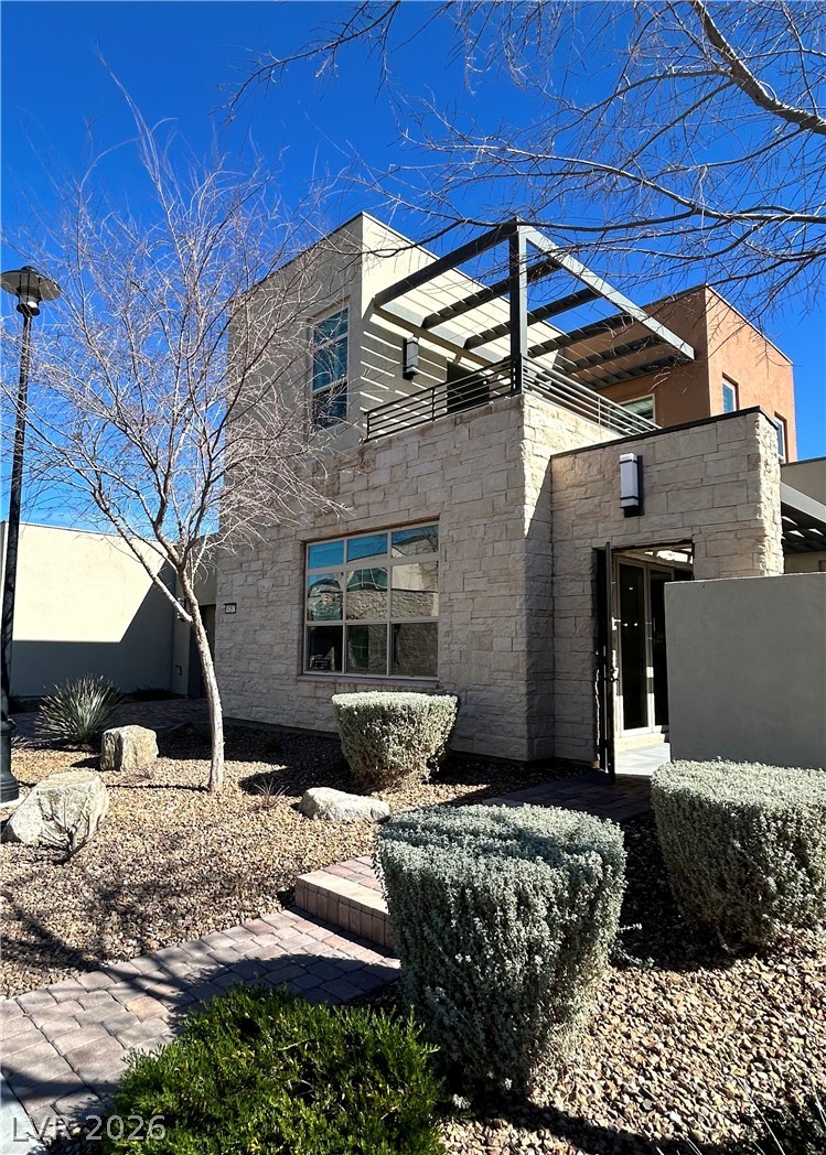 4262 Swift Street Las Vegas, NV 89135 - Photo 4 of 75 House featuring stone siding