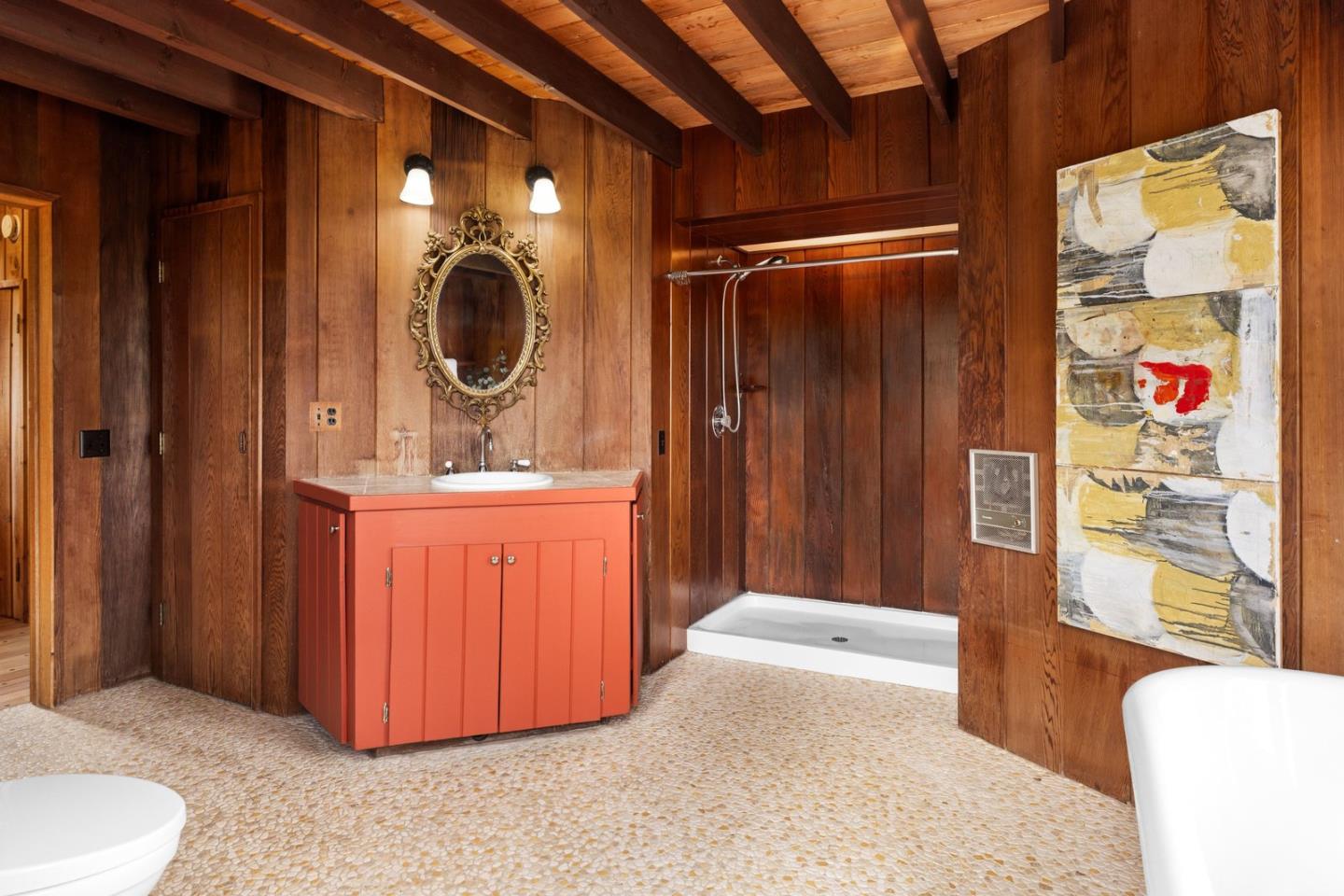 73 Mt Devon Road Carmel Highlands, CA 93923 - Photo 25 of 88 a bathroom with a sink a vanity and a mirror