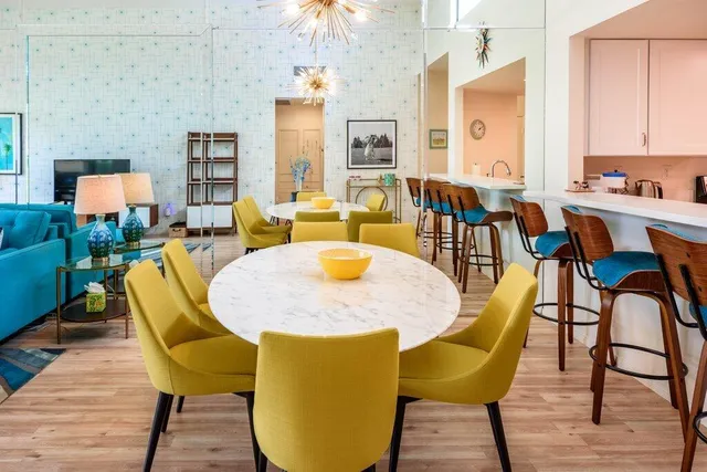 a kitchen with a refrigerator and a stove top oven