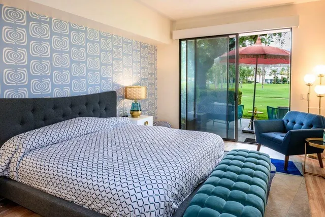 a bathroom with a sink vanity granite shower and a mirror