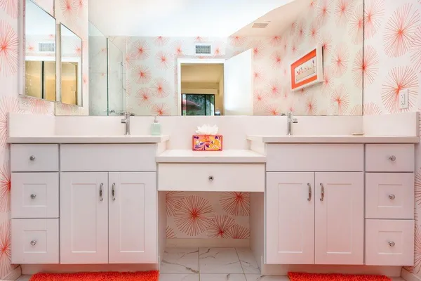 a kitchen with cabinets appliances and a sink