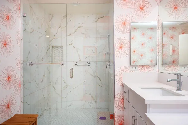 a bedroom with a bed and a desk