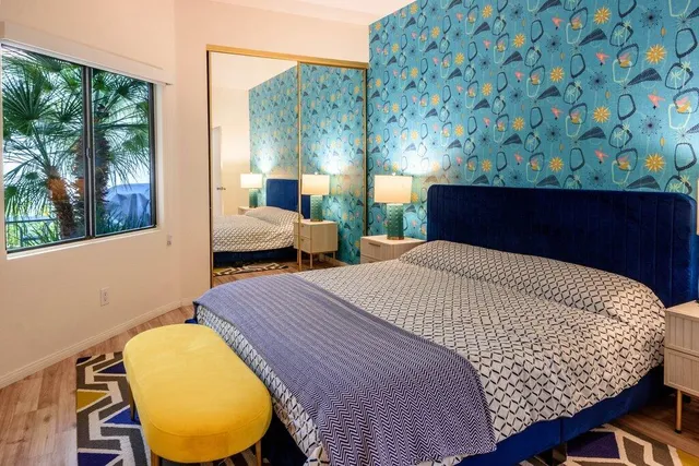 a patio with sofas fire pit and outdoor seating