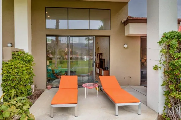swimming pool with outdoor seating and yard