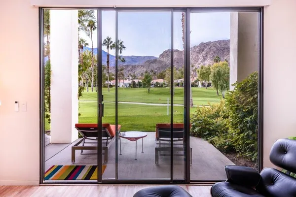 a view of swimming pool with outdoor seating