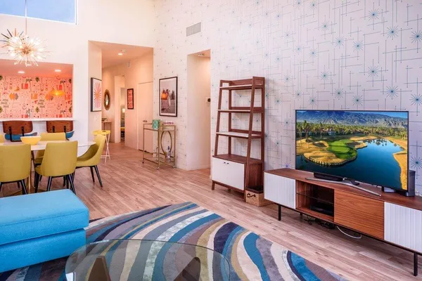 a living room with furniture and a flat screen tv