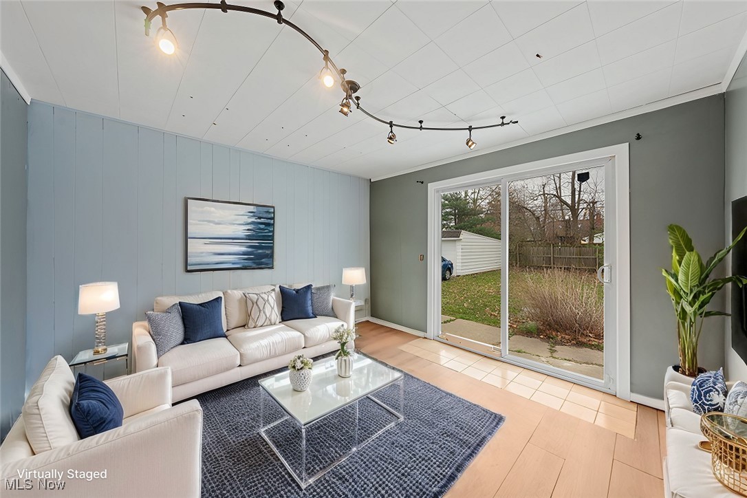 4146 Wyncote Road South Euclid, OH 44121 - Photo 10 of 20 Sunroom with rail lighting, sliding glass door and LVP floors