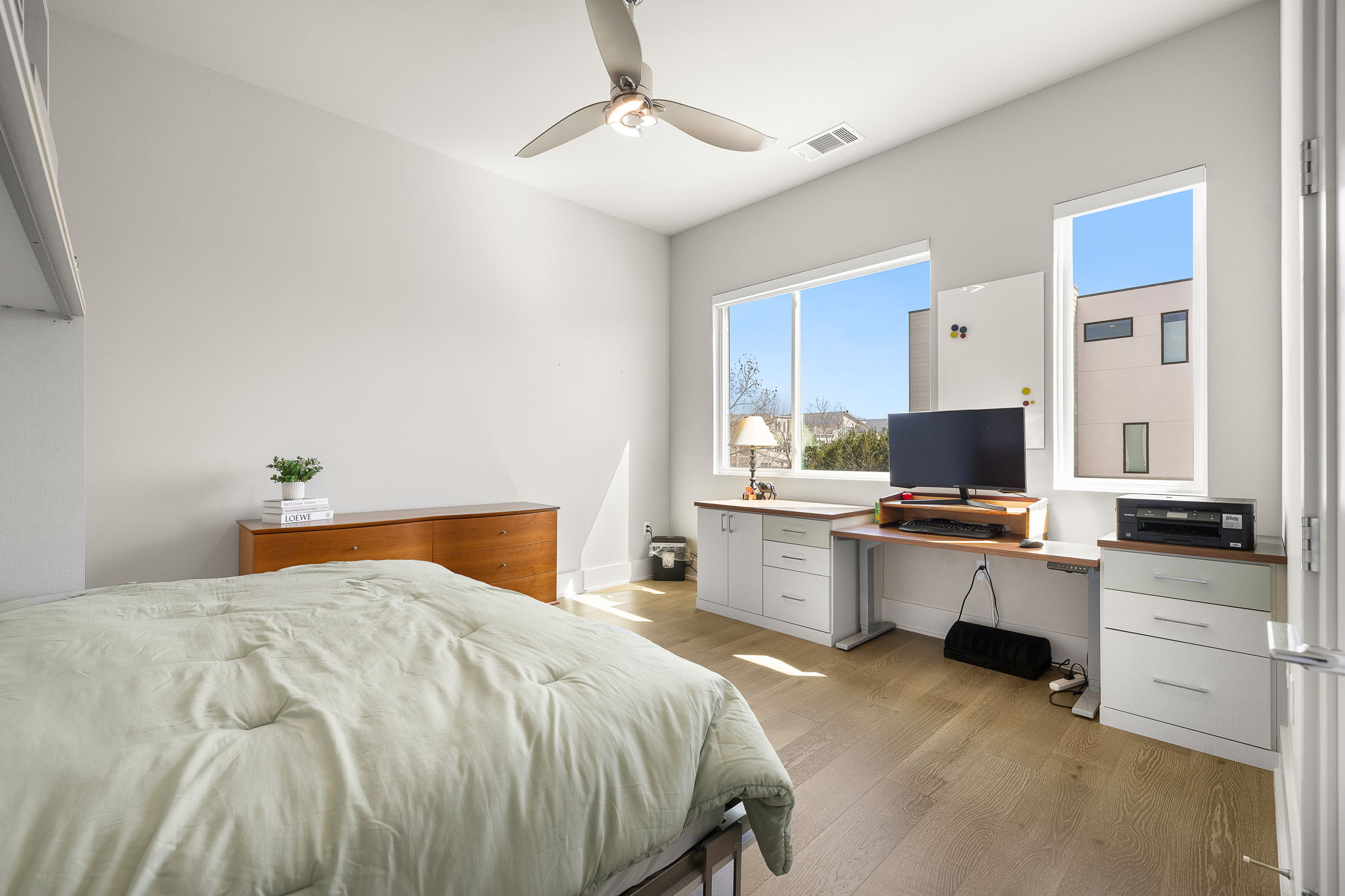 5214 Pink Poppy Pass Austin, TX 78735 - Photo 22 of 34 Bedroom featuring light wood finished floors, a ceiling fan, and an office area