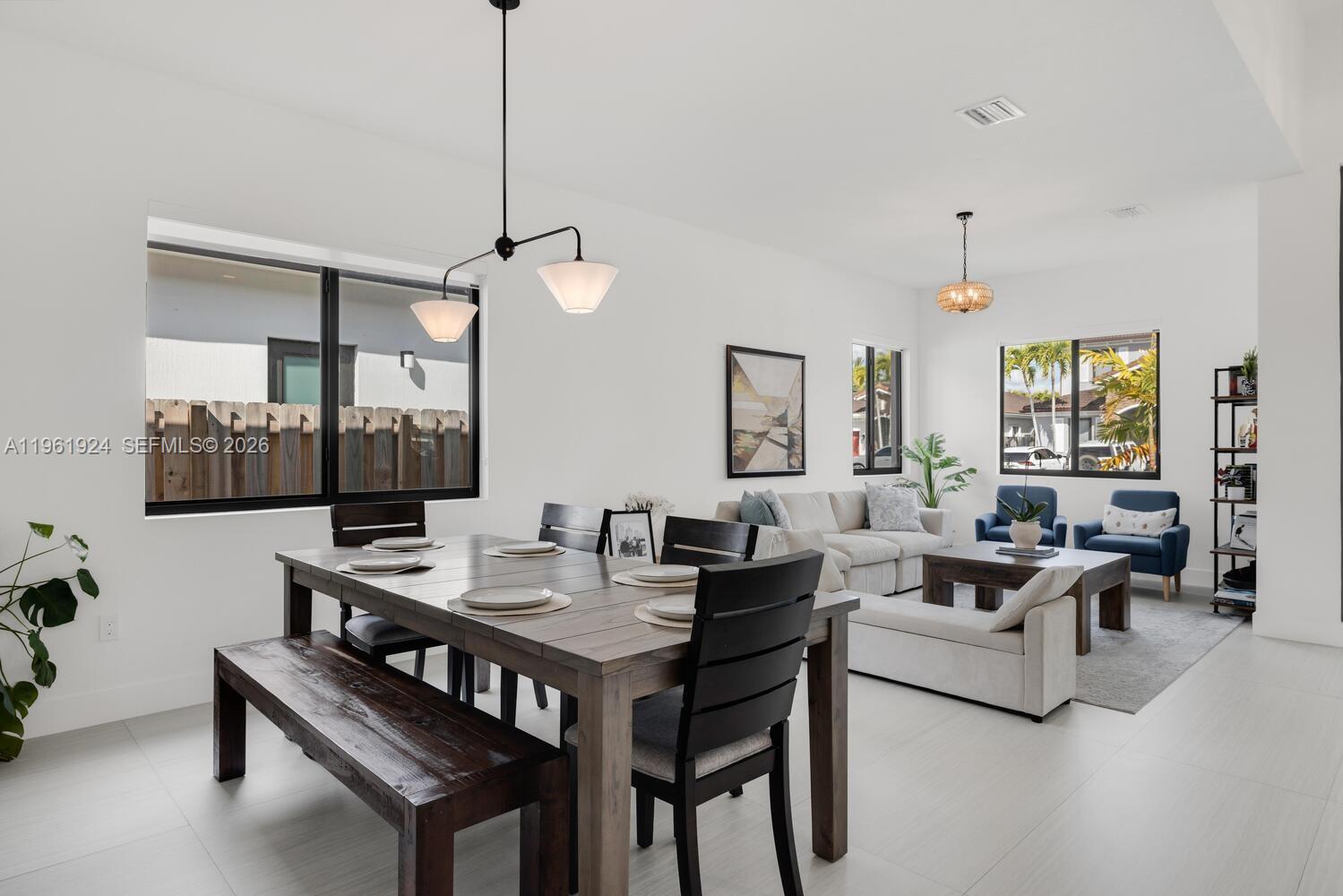 14468 Southwest 16th Street Miami, FL 33175 - Photo 17 of 46 a view of a dining room with furniture
