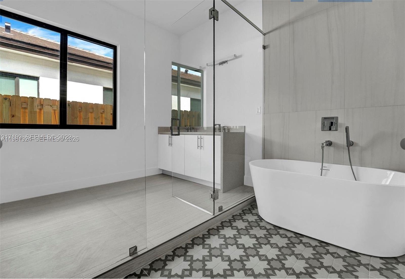 14468 Southwest 16th Street Miami, FL 33175 - Photo 18 of 46 a bathroom with a bathtub and mirror