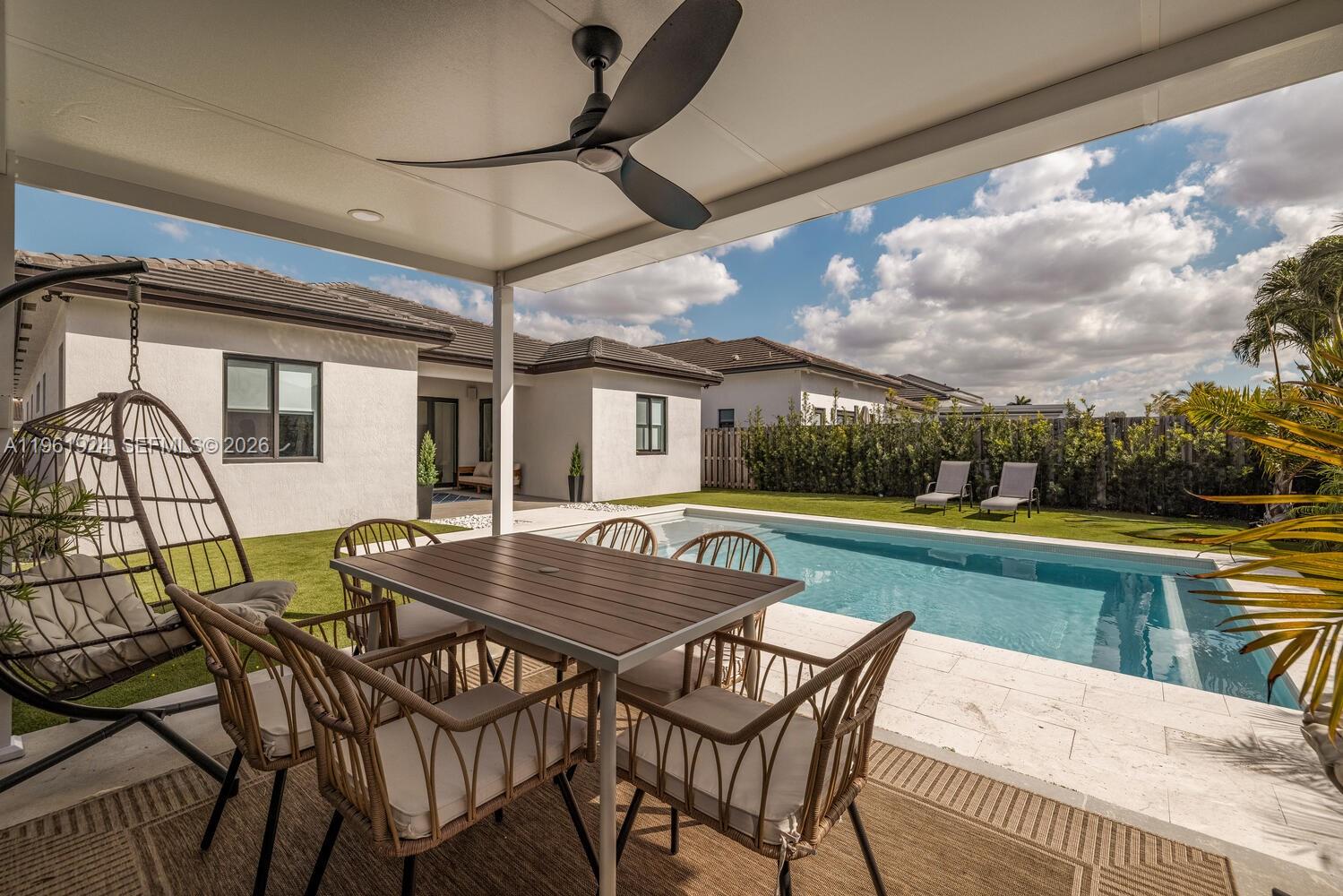 14468 Southwest 16th Street Miami, FL 33175 - Photo 20 of 46 a patio with a table chairs and a barbeque