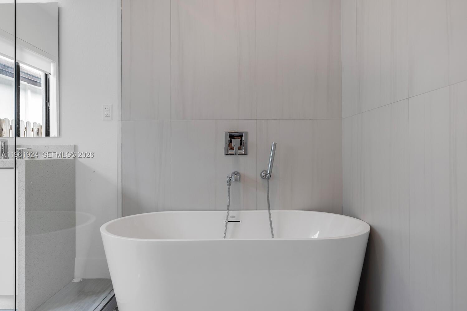 14468 Southwest 16th Street Miami, FL 33175 - Photo 23 of 46 a white bath tub sitting in a bathroom