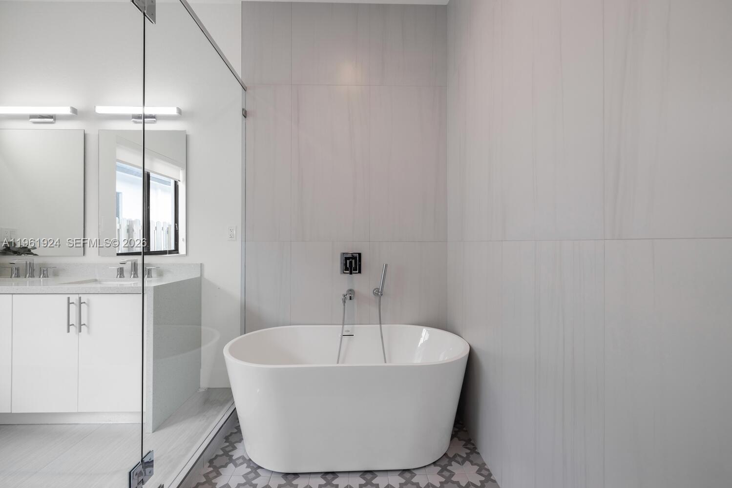 14468 Southwest 16th Street Miami, FL 33175 - Photo 24 of 46 a bathroom with a bathtub and shower