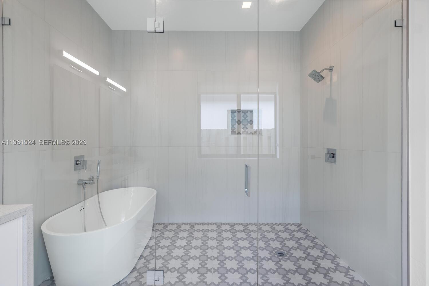 14468 Southwest 16th Street Miami, FL 33175 - Photo 25 of 46 a bathroom with a bathtub and shower