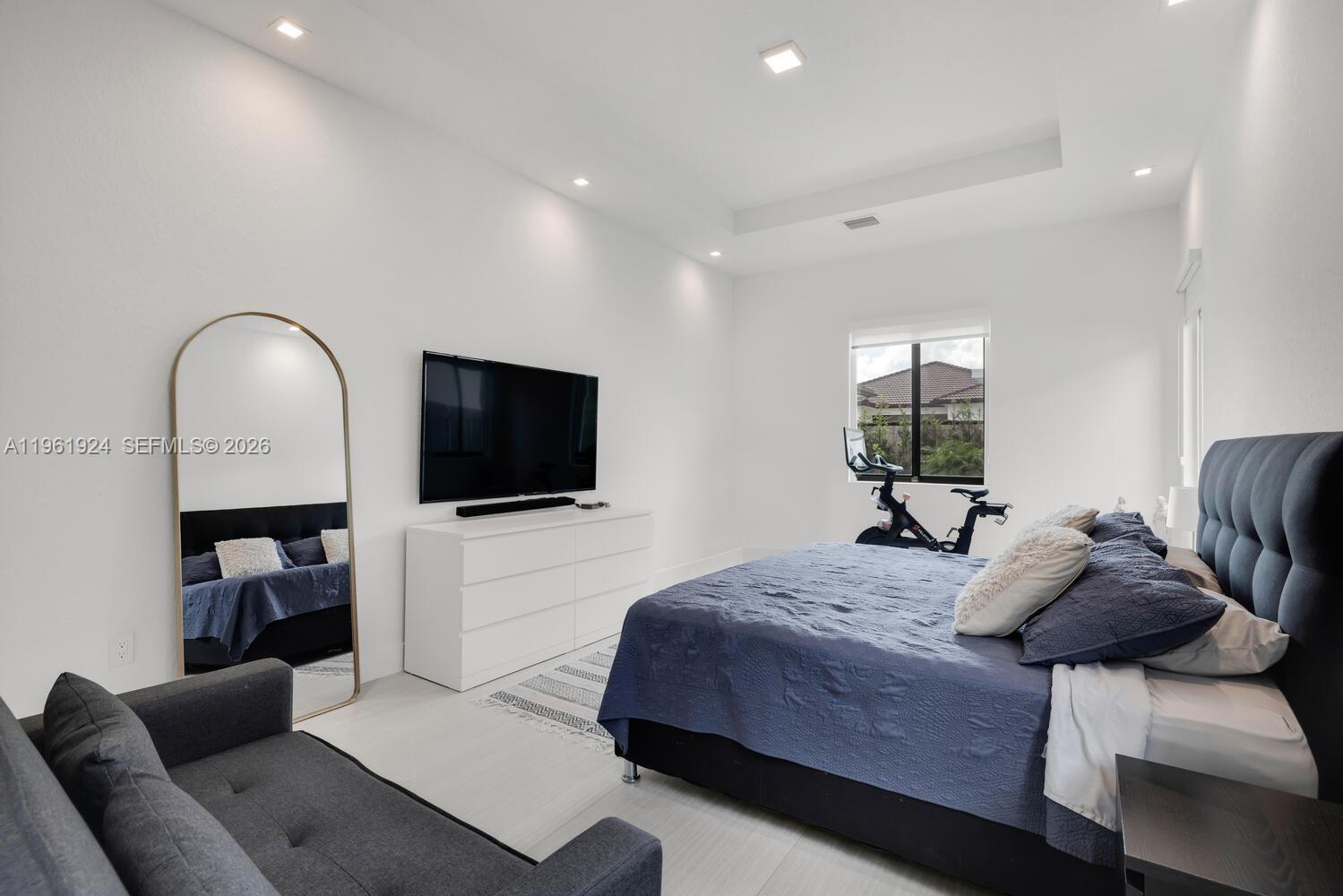 14468 Southwest 16th Street Miami, FL 33175 - Photo 28 of 46 a bedroom with furniture and a flat screen tv