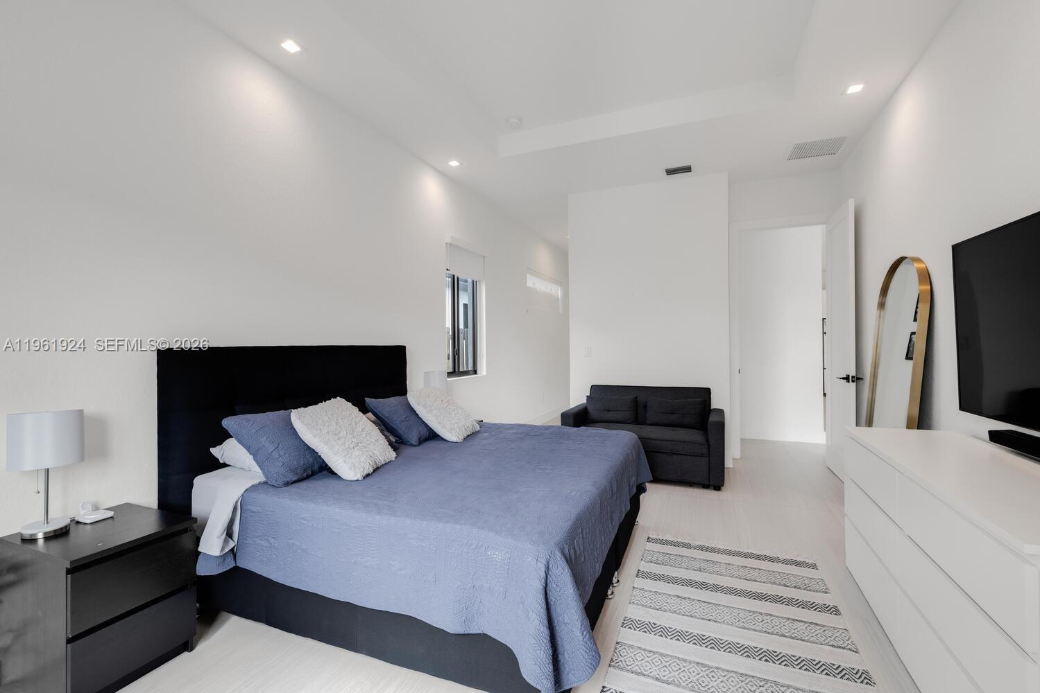 14468 Southwest 16th Street Miami, FL 33175 - Photo 29 of 46 a bedroom with double bed and a walk in closet