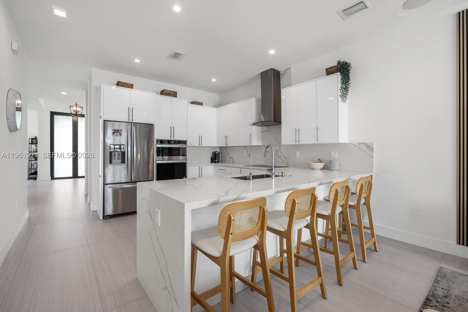 14468 Southwest 16th Street Miami, FL 33175 - Photo 31 of 46 a large kitchen with stainless steel appliances a refrigerator and a stove top oven