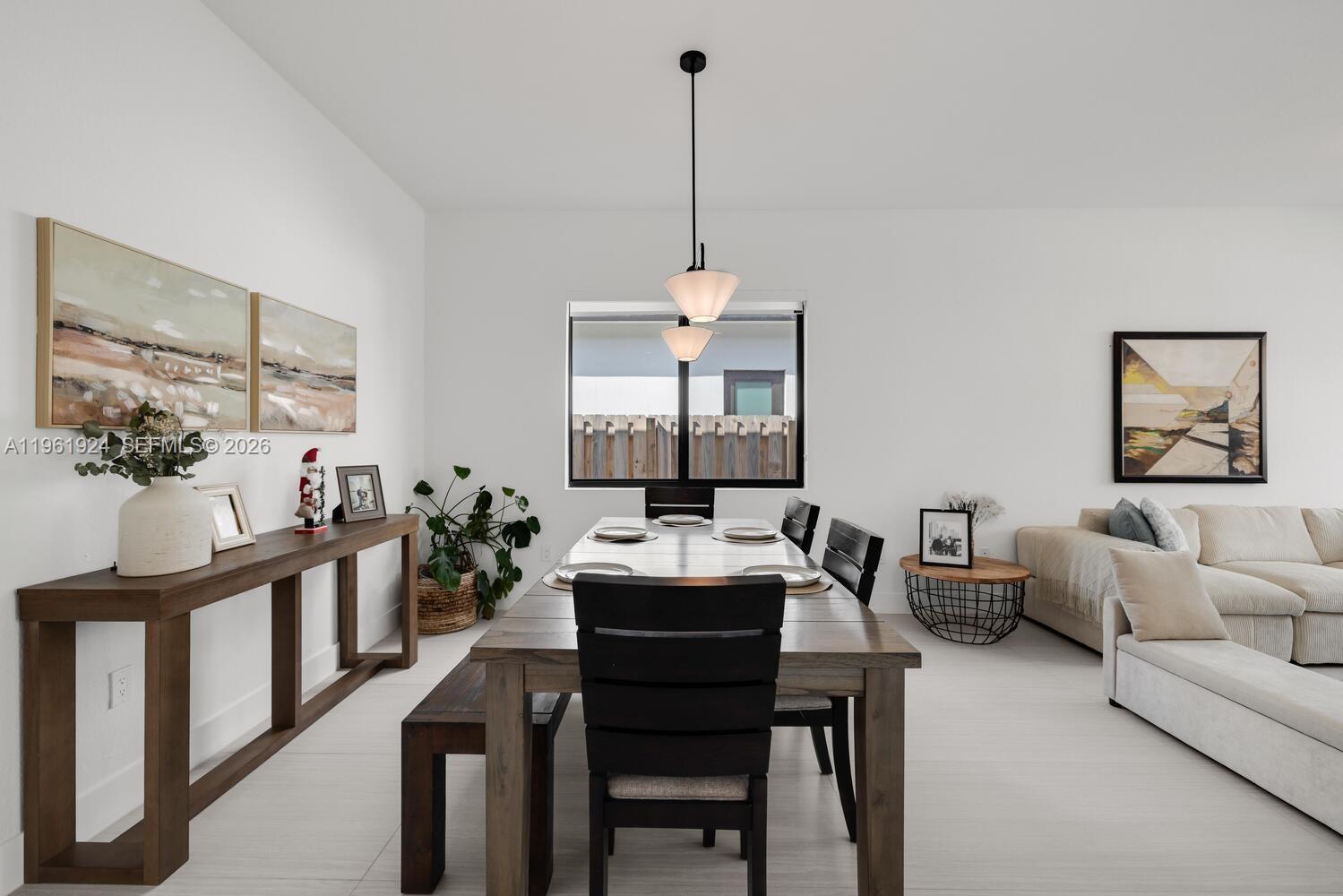 14468 Southwest 16th Street Miami, FL 33175 - Photo 36 of 46 a dining room with furniture and window
