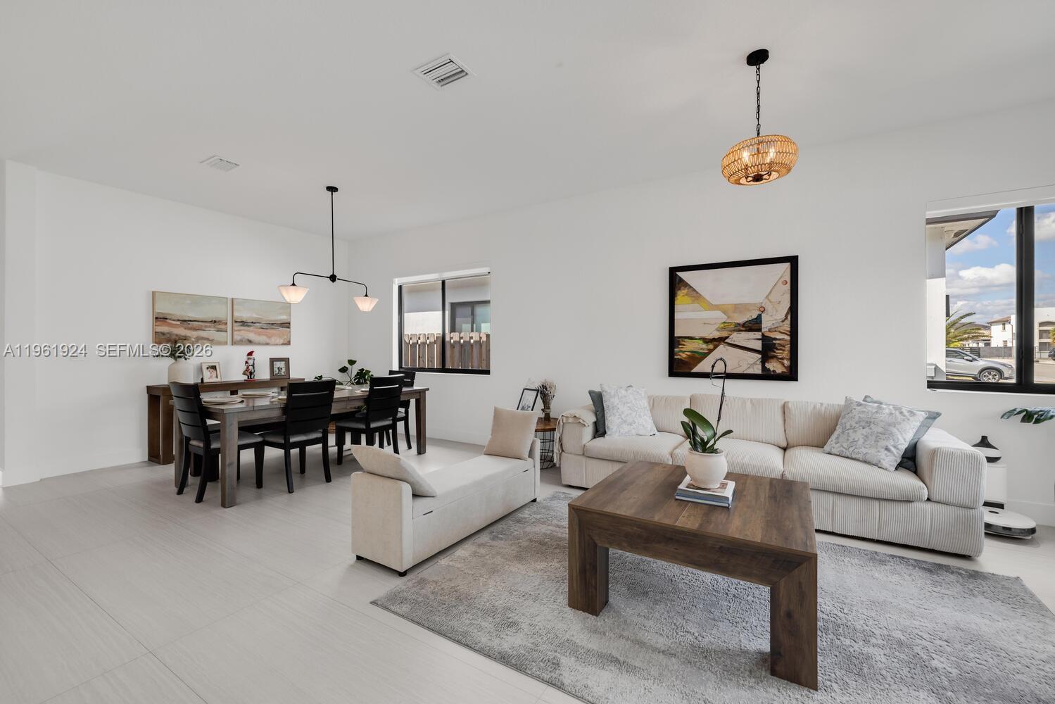 14468 Southwest 16th Street Miami, FL 33175 - Photo 37 of 46 a living room with furniture and a chandelier
