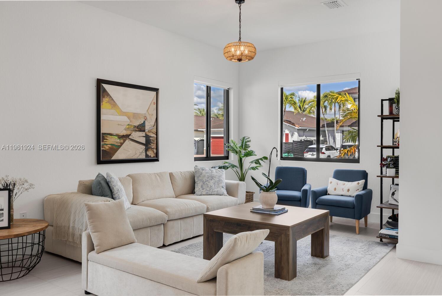 14468 Southwest 16th Street Miami, FL 33175 - Photo 38 of 46 a living room with furniture and a large window