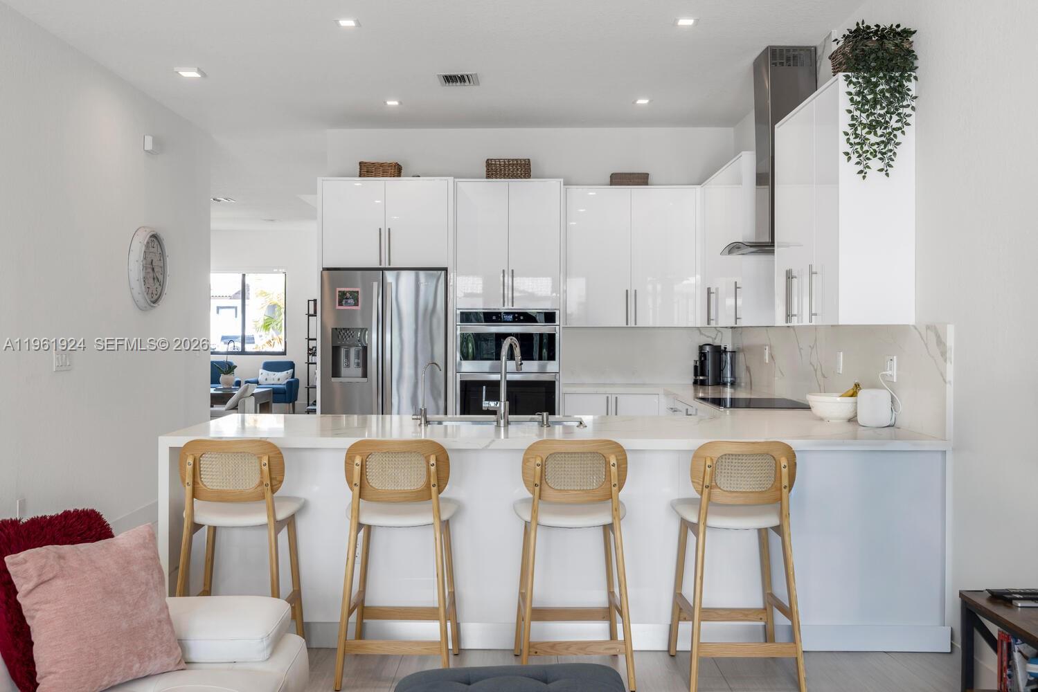 14468 Southwest 16th Street Miami, FL 33175 - Photo 4 of 46 a kitchen with stainless steel appliances granite countertop a refrigerator and microwave