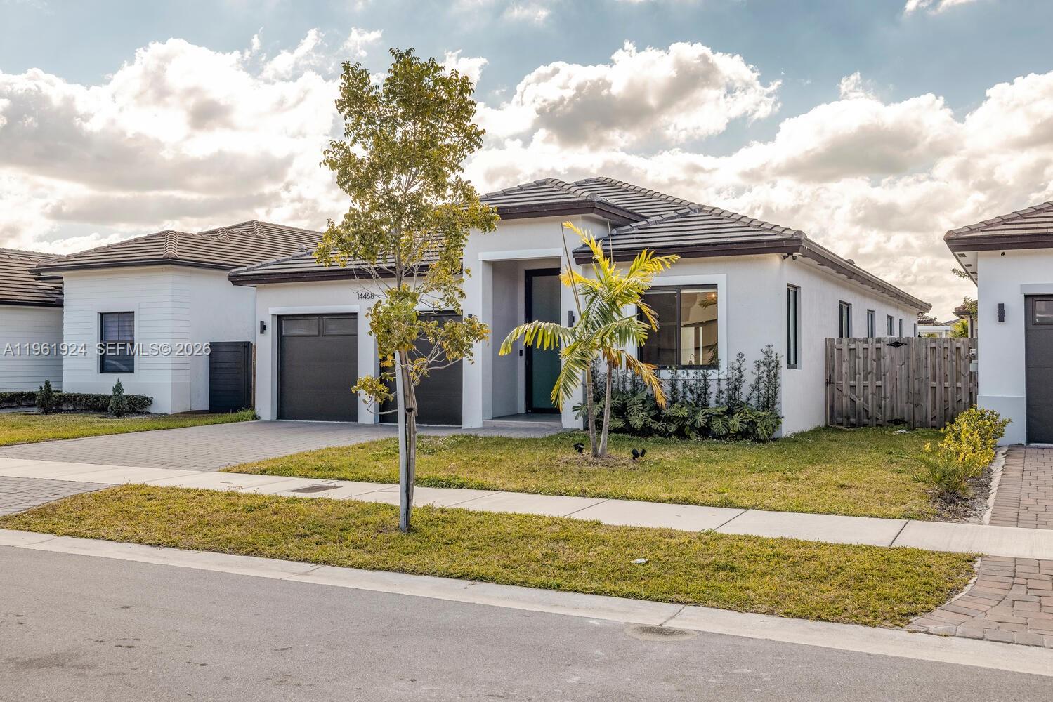 14468 Southwest 16th Street Miami, FL 33175 - Photo 45 of 46 a view of a house bed and a yard