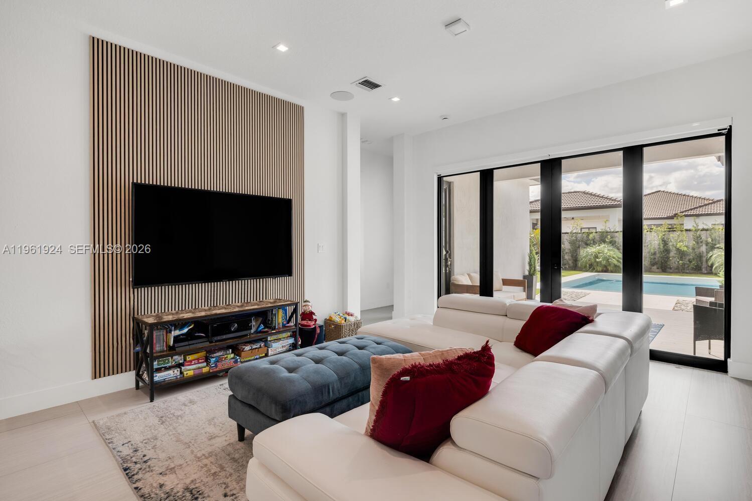 14468 Southwest 16th Street Miami, FL 33175 - Photo 5 of 46 a living room with furniture and a flat screen tv