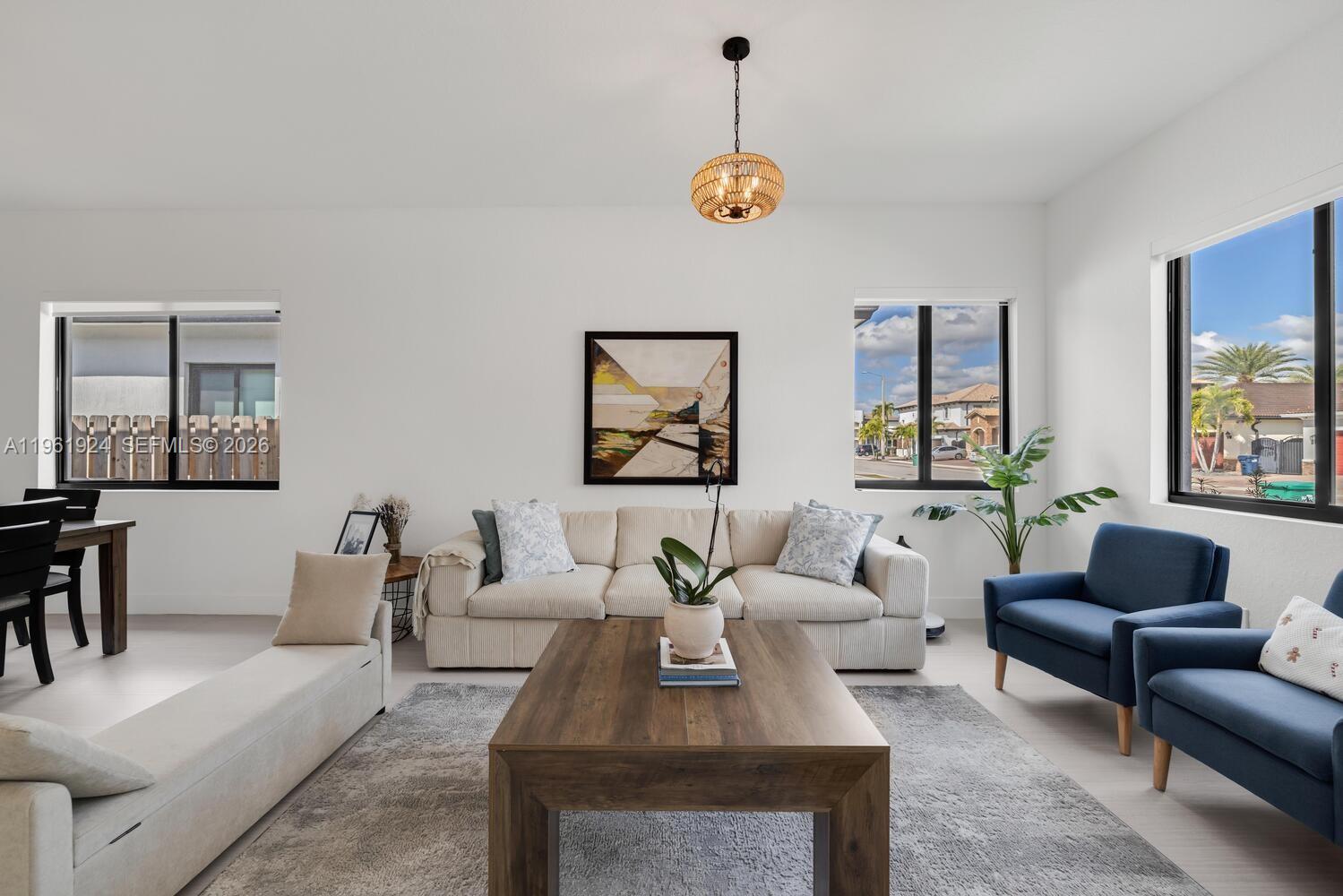 14468 Southwest 16th Street Miami, FL 33175 - Photo 6 of 46 a living room with furniture a table and a window