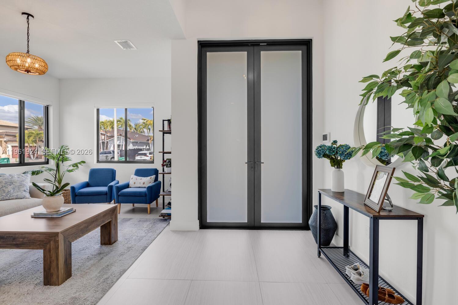 14468 Southwest 16th Street Miami, FL 33175 - Photo 8 of 46 a living room with furniture and a potted plant