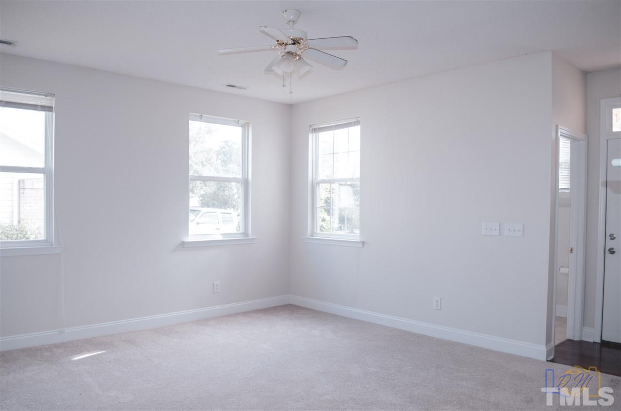 2636 Quarry Ridge Lane Raleigh, NC 27610 - Photo 2 of 12 an empty room with a window and a fan