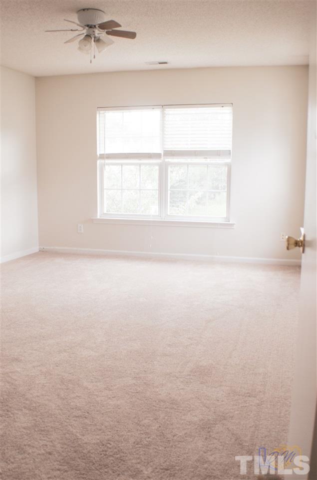 2636 Quarry Ridge Lane Raleigh, NC 27610 - Photo 11 of 12 an empty room with a window