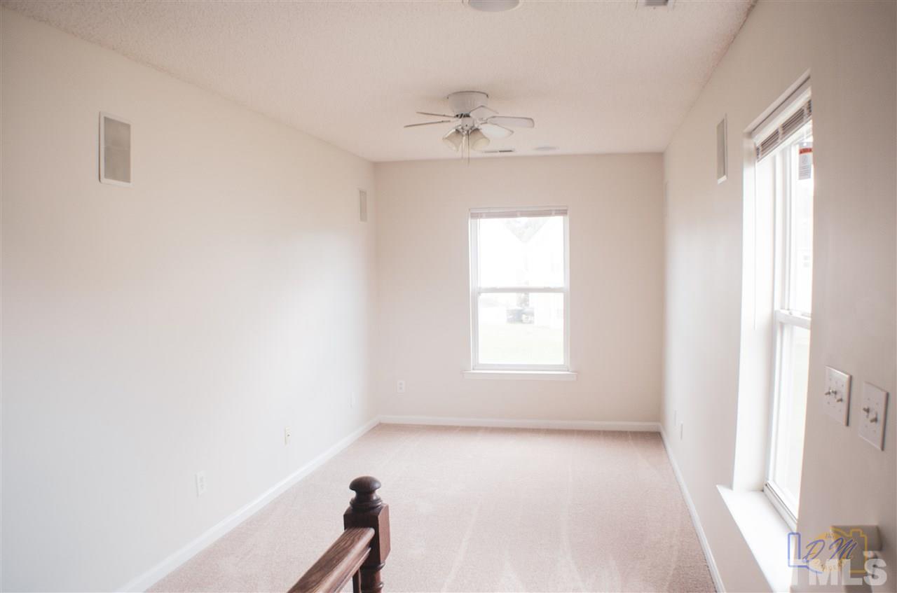 2636 Quarry Ridge Lane Raleigh, NC 27610 - Photo 7 of 12 a view of an empty room with a window
