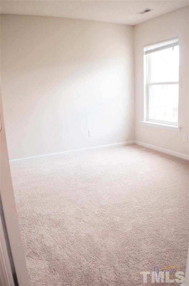 2636 Quarry Ridge Lane Raleigh, NC 27610 - Photo 10 of 12 an empty room with a window