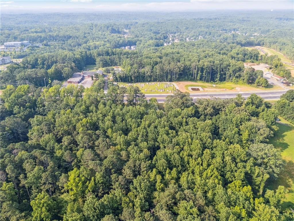 0 Cumming Highway Canton, GA 30115 - Photo 4 of 9 an aerial view of a houses with a yard and lake
