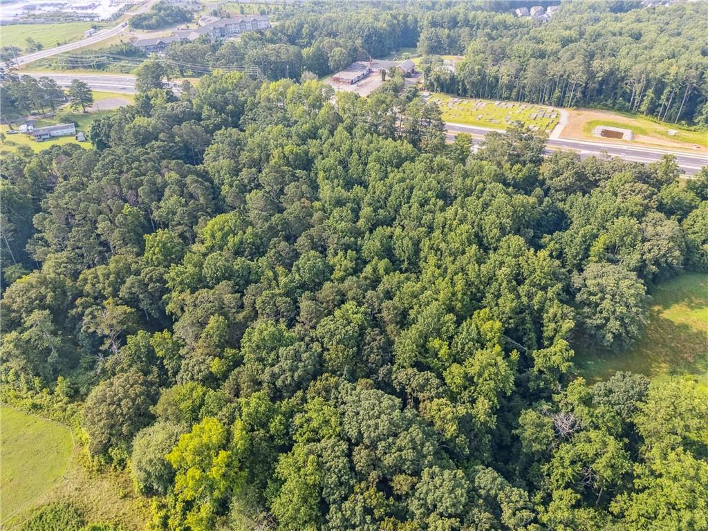 0 Cumming Highway Canton, GA 30115 - Photo 5 of 9 a view of a swimming pool with a yard