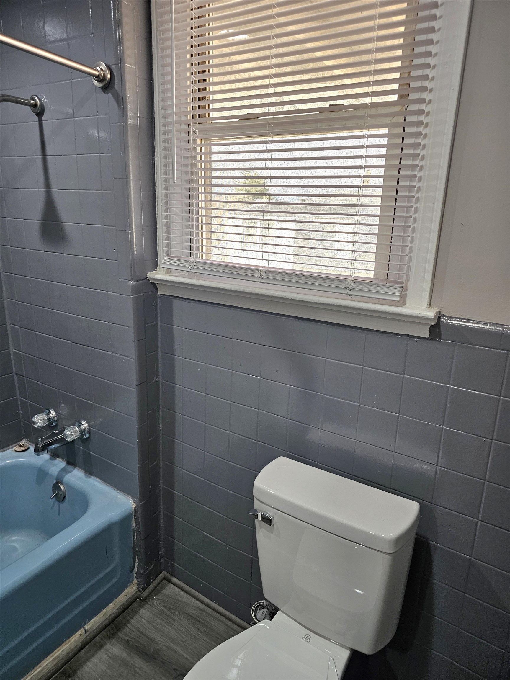 127-129 West 3rd Street, Unit 3 Bayonne, NJ 07002 - Photo 5 of 10 a bathroom with a toilet a sink and shower