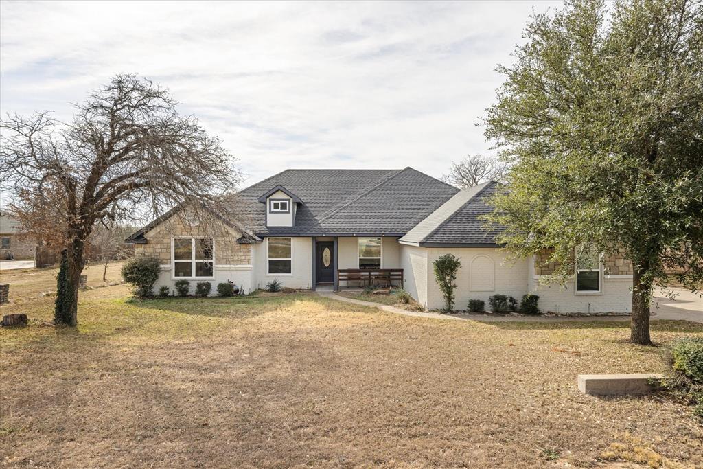 4801 West Wedgefield Road Granbury, TX 76049 - Photo 30 of 40 a view of a house with a yard covered in snow