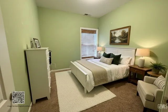 a bedroom with a bed and a couch