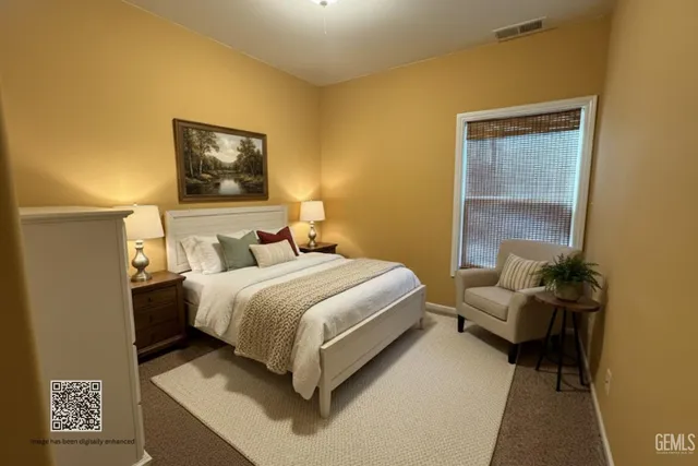 a bedroom with a bed and a mirror